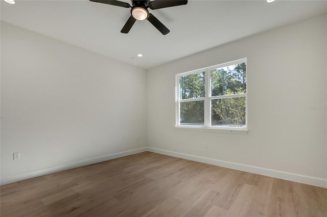 unfurnished room with light hardwood / wood-style flooring and ceiling fan