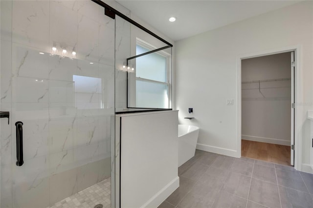 bathroom featuring independent shower and bath and tile patterned floors