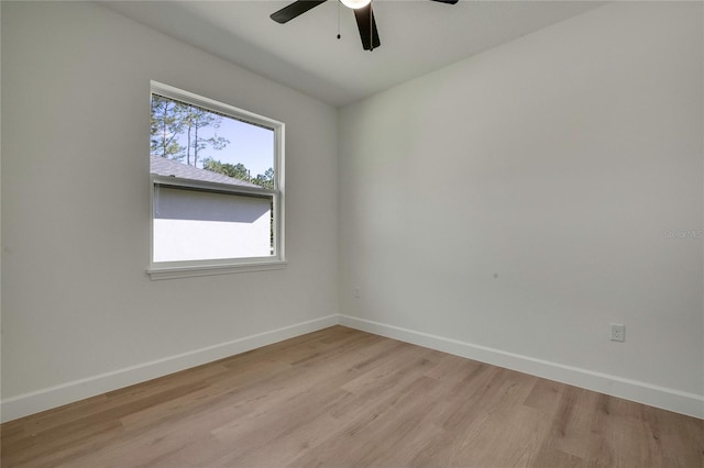 empty room with ceiling fan and light wood-type flooring