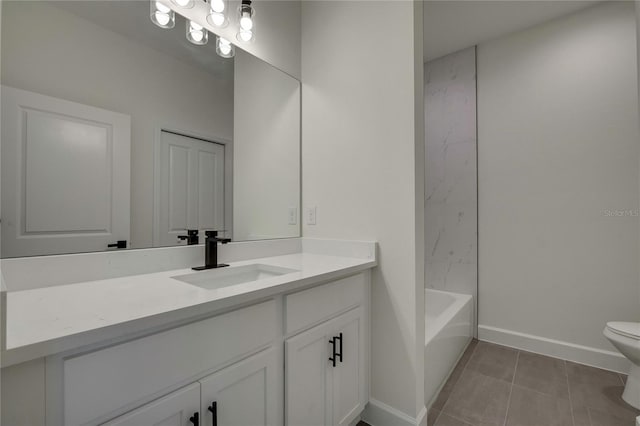 bathroom featuring toilet, vanity, and tile patterned floors