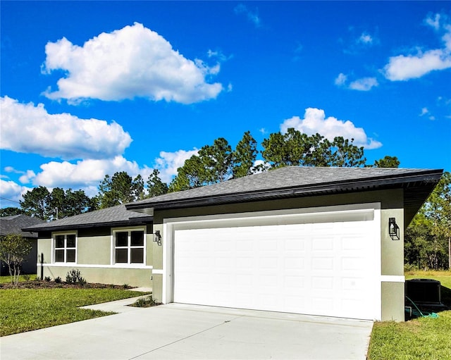 view of front of house featuring a front yard and a garage