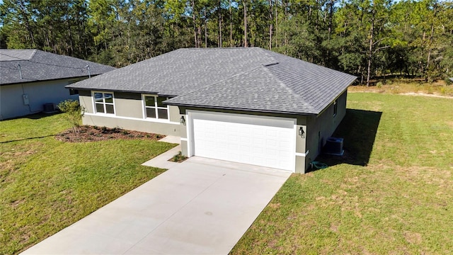 ranch-style home with central air condition unit, a front yard, and a garage