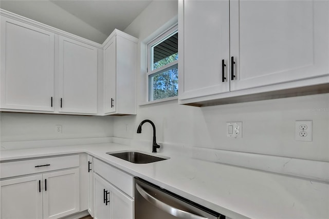 kitchen featuring sink, white cabinetry, and dishwasher