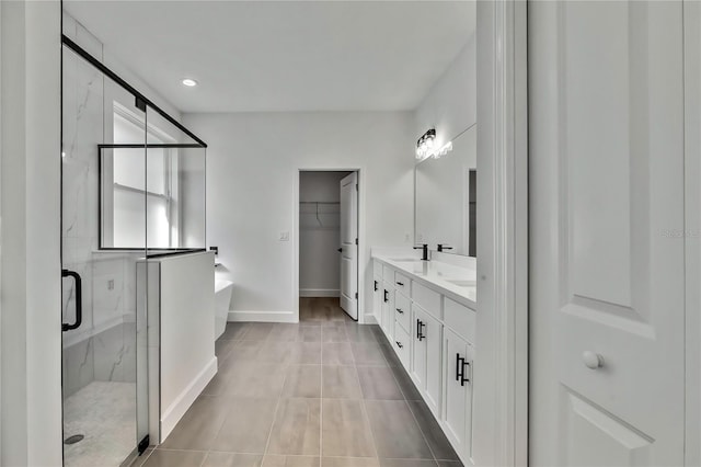 8118 N Santos Dr, Citrus Springs, FL 34434 - bathroom with a freestanding tub, double vanity, a marble finish shower, tile patterned floors, and baseboards
