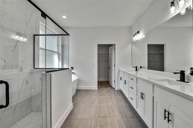 bathroom with vanity, a shower with shower door, and tile patterned flooring