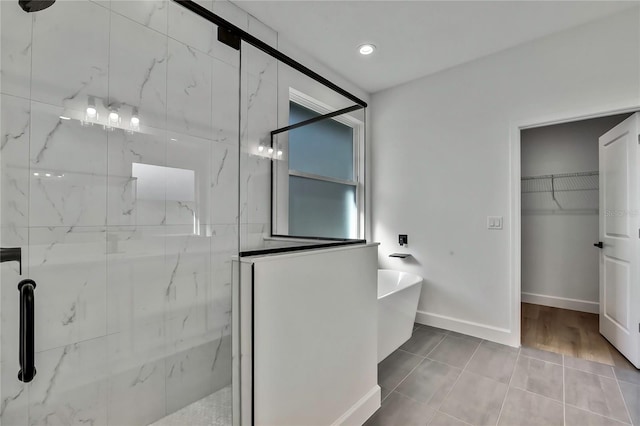 bathroom with hardwood / wood-style floors and plus walk in shower