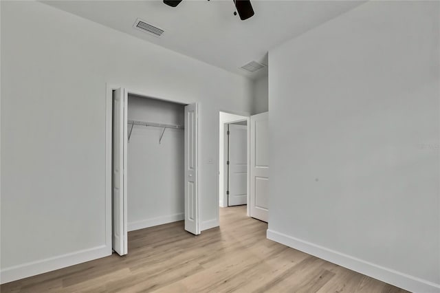 unfurnished bedroom with a closet, ceiling fan, and light hardwood / wood-style floors