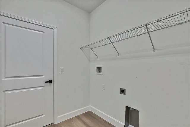 laundry room featuring light hardwood / wood-style flooring, hookup for an electric dryer, and hookup for a washing machine