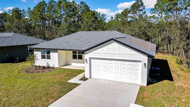 ranch-style house featuring a front yard and a garage