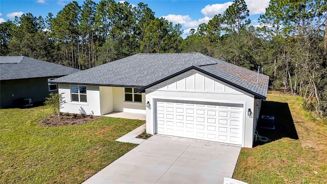 8118 N Santos Dr, Citrus Springs, FL 34434 - ranch-style house featuring a shingled roof, a front lawn, a garage, and board and batten siding