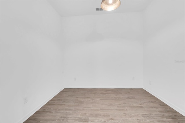 spare room featuring light wood-type flooring