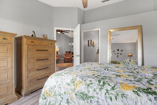 bedroom with light hardwood / wood-style flooring and ceiling fan