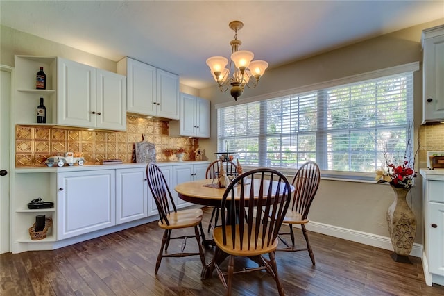 dining room featuring a chandelier and dark hardwood / wood-style flooring