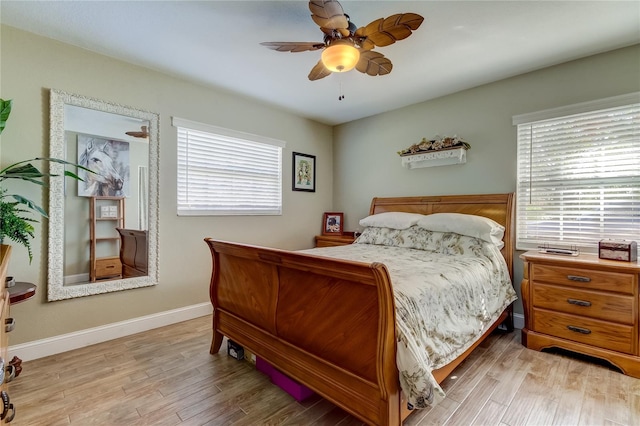 bedroom with light wood-type flooring and ceiling fan