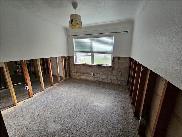 empty room with a textured ceiling