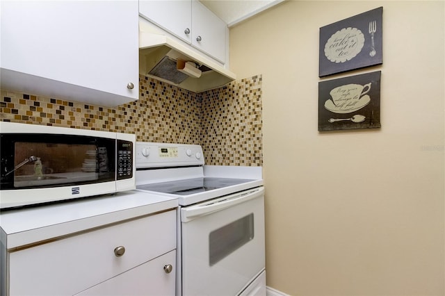 kitchen with white cabinets, white appliances, and tasteful backsplash