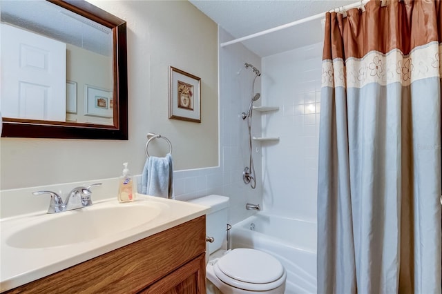 full bathroom with vanity, a textured ceiling, toilet, and shower / bathtub combination with curtain