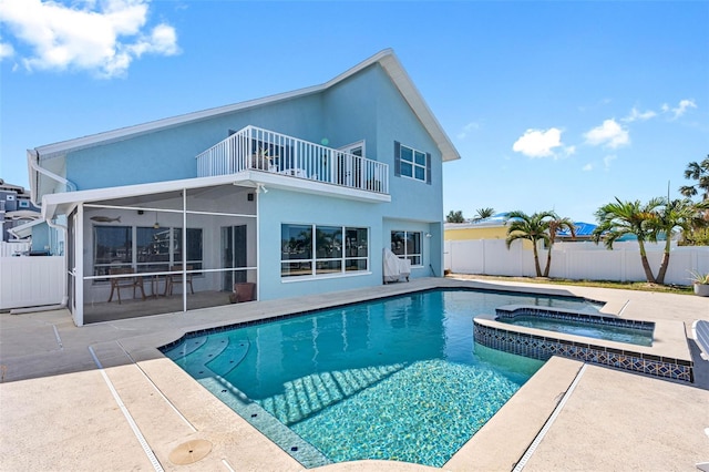 view of pool with a patio and an in ground hot tub