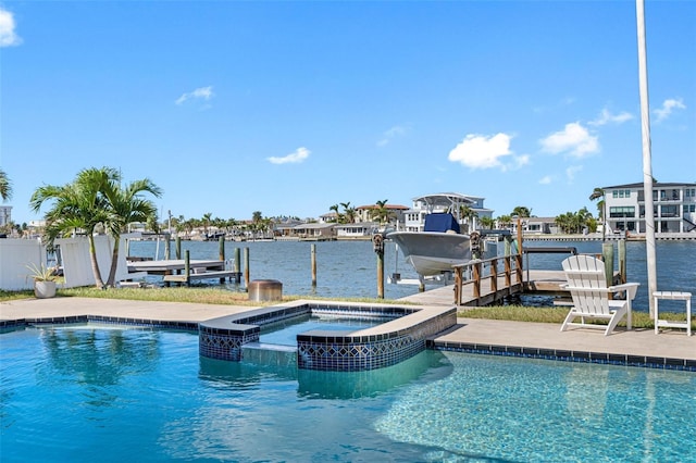 view of pool featuring an in ground hot tub and a water view