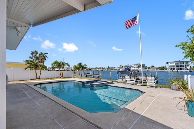 view of swimming pool with a patio area, an in ground hot tub, and a water view