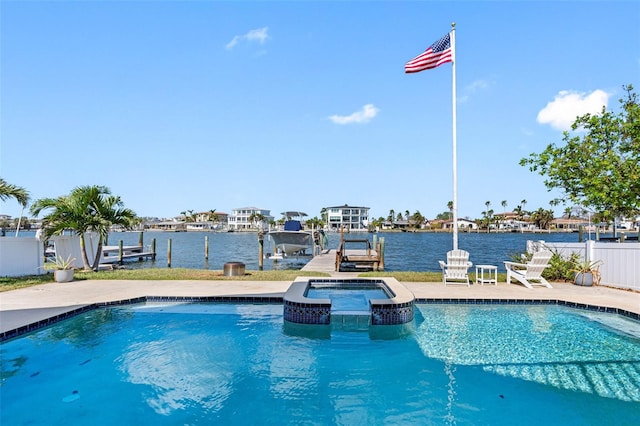 view of swimming pool featuring a patio, an in ground hot tub, and a water view