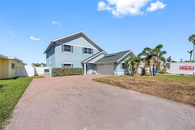 view of front of home with a garage