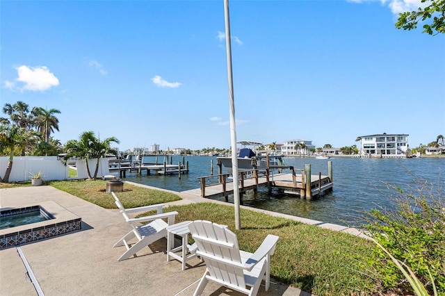 view of dock with a patio, an in ground hot tub, and a water view