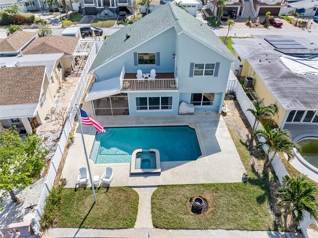 view of swimming pool with a patio and an in ground hot tub