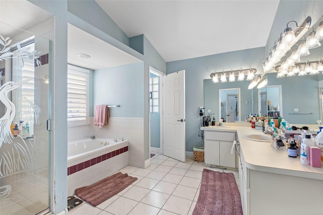 bathroom with vanity, tile patterned floors, separate shower and tub, and a wealth of natural light