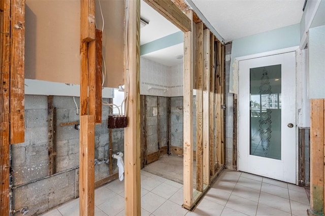 misc room featuring light tile patterned flooring