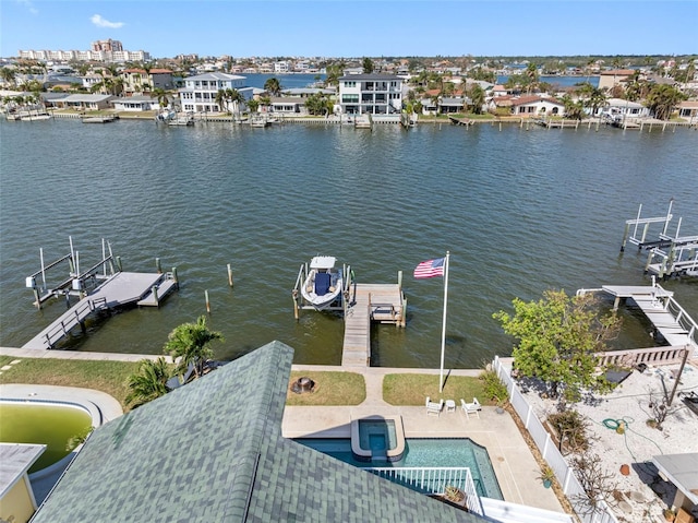 view of dock with a water view and a patio area