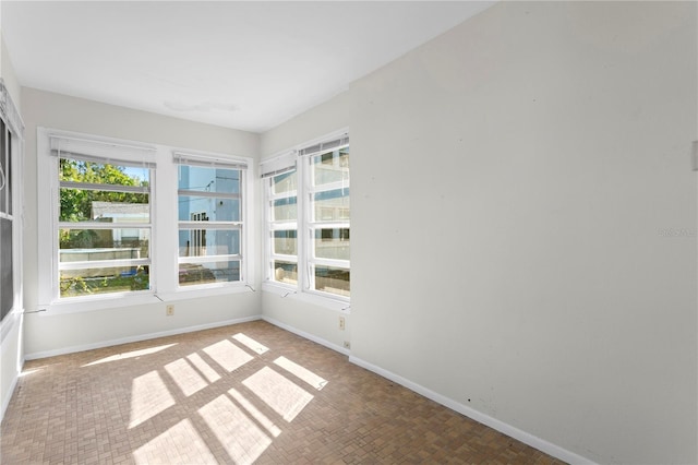 unfurnished sunroom featuring plenty of natural light