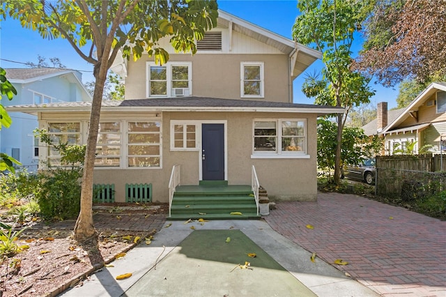 view of front of home with cooling unit