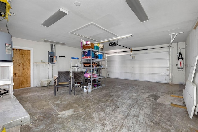 garage with electric water heater, electric panel, and a garage door opener