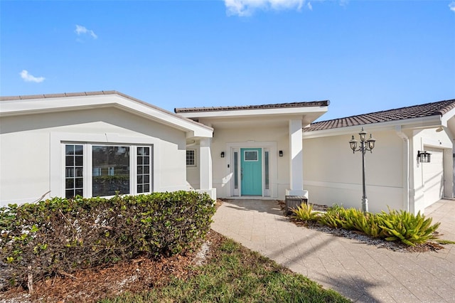 doorway to property featuring a garage