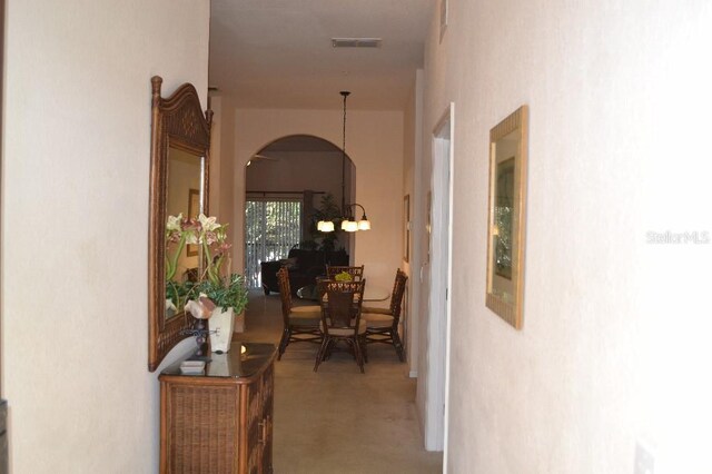 511 Rum Run Unit 33-511, Davenport, FL 33897 - hall featuring arched walkways and carpet floors