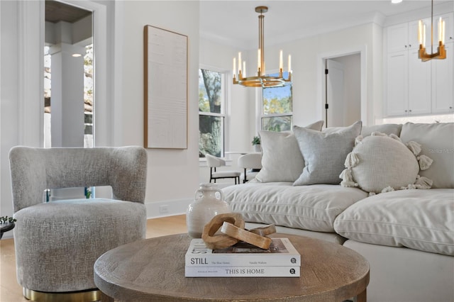 living room with an inviting chandelier and wood-type flooring