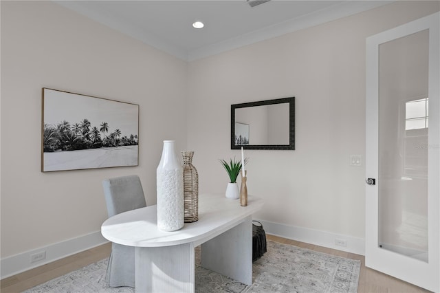 home office with light hardwood / wood-style flooring