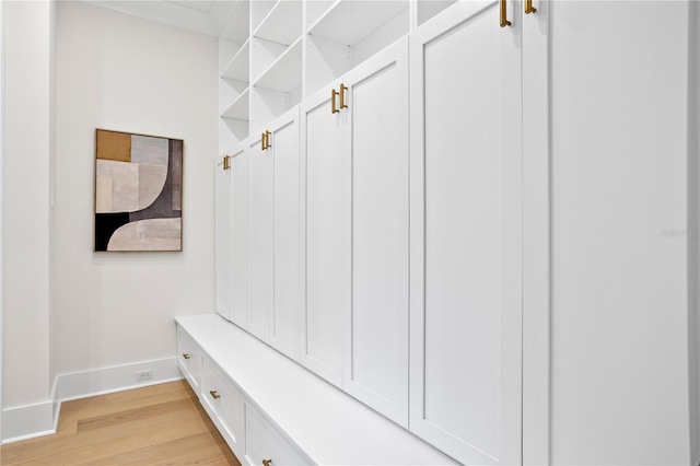 mudroom with light hardwood / wood-style flooring