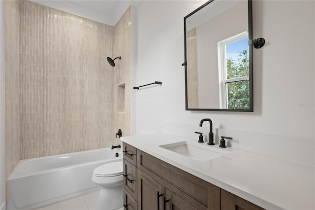 full bathroom with vanity, tiled shower / bath combo, tile patterned floors, and toilet