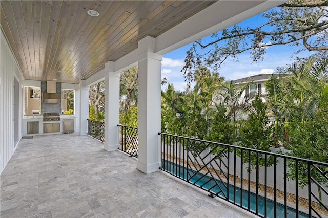 balcony with area for grilling and a patio area