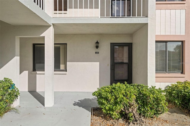 entrance to property featuring a patio area