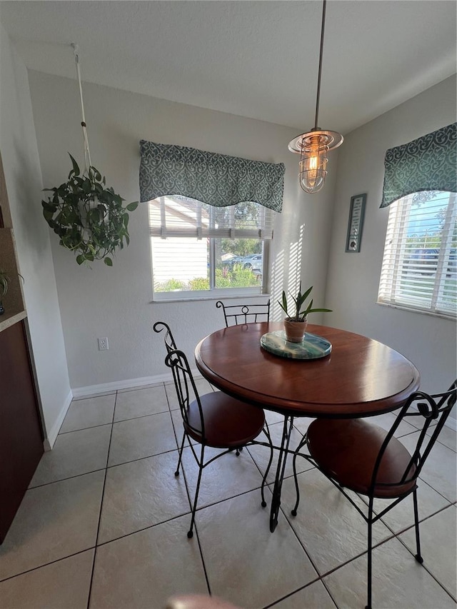 dining area featuring a healthy amount of sunlight and light tile patterned floors