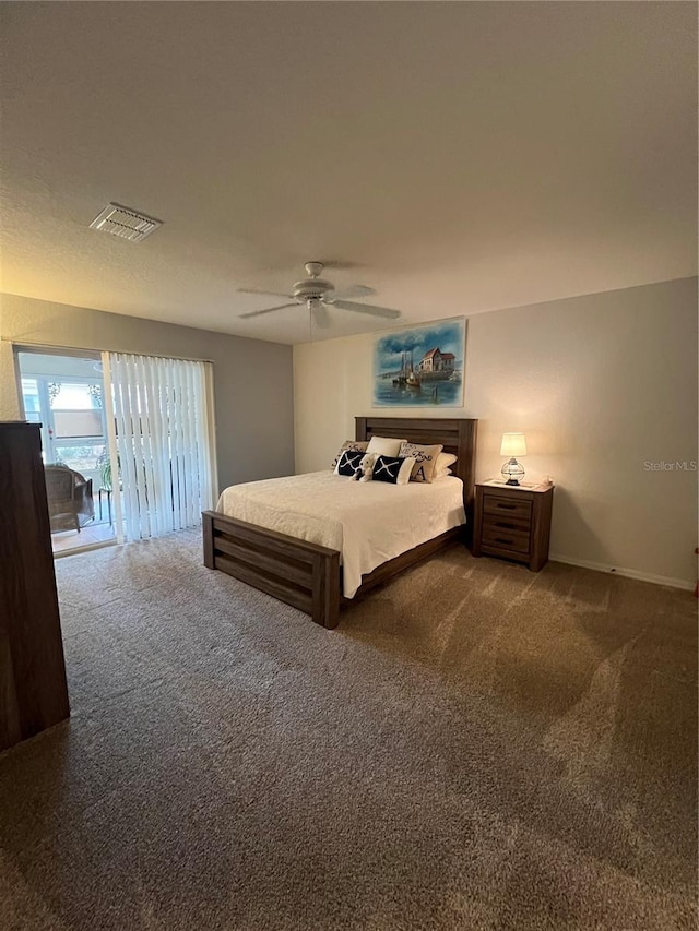 carpeted bedroom with ceiling fan and access to exterior