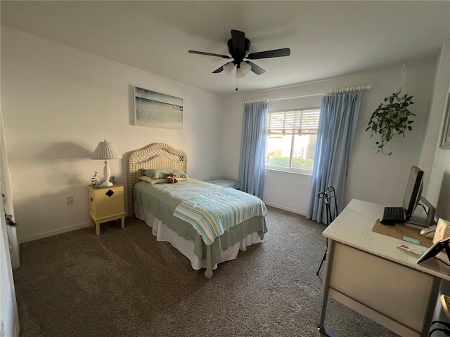 bedroom featuring ceiling fan and dark colored carpet