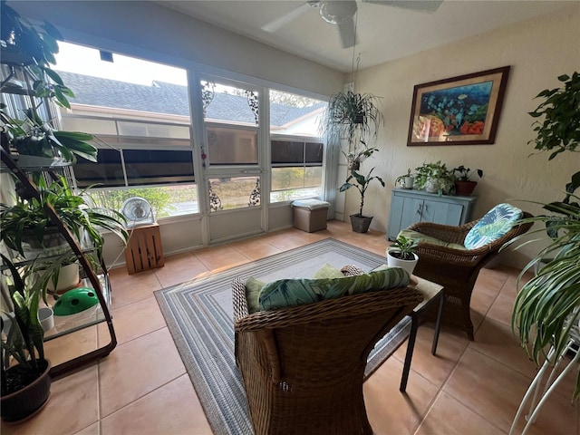 sunroom with a healthy amount of sunlight and ceiling fan