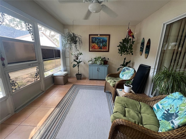 sunroom / solarium featuring ceiling fan