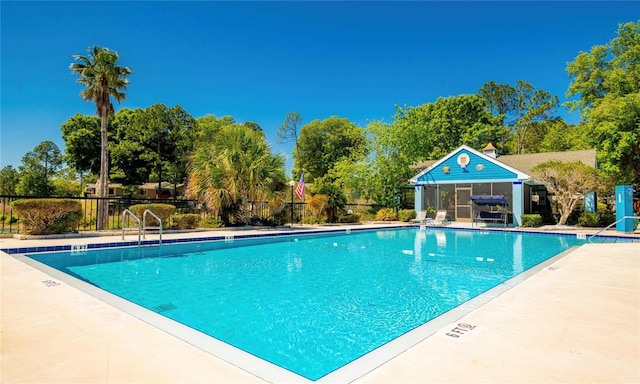 view of swimming pool with a patio area