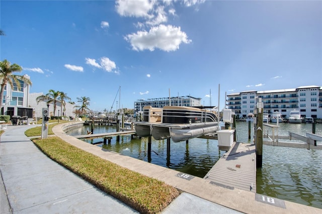 view of dock with boat lift and a water view