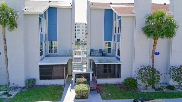 view of property featuring stairs